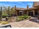 Backyard patio with tilework and desert landscaping that surrounds the home and pool area at 23760 N 80Th Way, Scottsdale, AZ 85255