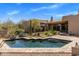In-ground pool with brick trim and stairs, surrounded by desert landscaping and the exterior of the home at 23760 N 80Th Way, Scottsdale, AZ 85255
