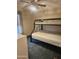 A bedroom featuring a bunk bed, ceiling fan, and carpeted floors at 2400 E Baseline Ave # 201, Apache Junction, AZ 85119