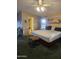 Comfortable bedroom with ceiling fan, ensuite bathroom, and natural light from window at 2400 E Baseline Ave # 201, Apache Junction, AZ 85119