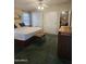 Comfortable bedroom with ceiling fan, and ensuite access at 2400 E Baseline Ave # 201, Apache Junction, AZ 85119