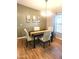 Inviting dining area with modern lighting, a stylish table set, and neutral décor at 2400 E Baseline Ave # 201, Apache Junction, AZ 85119