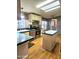 Bright kitchen featuring stainless steel appliances, breakfast bar, and open layout at 2400 E Baseline Ave # 201, Apache Junction, AZ 85119