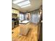 Open kitchen boasts stainless appliances, island, and seamless flow to living area at 2400 E Baseline Ave # 201, Apache Junction, AZ 85119