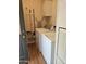 Functional laundry room featuring a washer, dryer, and shelving for storage at 2400 E Baseline Ave # 201, Apache Junction, AZ 85119