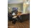 Inviting living room boasts vaulted ceiling, updated flooring, and cozy, plush furnishings at 2400 E Baseline Ave # 201, Apache Junction, AZ 85119