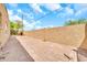 Enjoy this spacious backyard with block fencing and a view of the bright blue sky at 2546 N 9Th St, Phoenix, AZ 85006