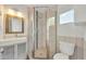 Compact bathroom featuring tile shower, framed mirror and sink, and toilet at 2546 N 9Th St, Phoenix, AZ 85006