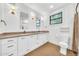 Bright bathroom features double sinks, large mirrors, and natural light from a window at 2546 N 9Th St, Phoenix, AZ 85006