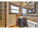 Charming bathroom with decorative sink and fixtures, tile backsplash, and a window for natural light at 2546 N 9Th St, Phoenix, AZ 85006
