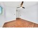 Simple bedroom featuring hardwood floors, ceiling fan, closet, and natural light from one window at 2546 N 9Th St, Phoenix, AZ 85006