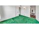 Cozy bedroom features green carpeting, white walls, and access to another room for flexible living at 2546 N 9Th St, Phoenix, AZ 85006
