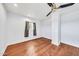 Bright bedroom with wood floors, white walls, a ceiling fan, and window with natural light at 2546 N 9Th St, Phoenix, AZ 85006