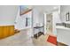 Bright entryway with concrete floors, view of second story and staircase, plus access to powder room at 2546 N 9Th St, Phoenix, AZ 85006