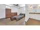 Bright main bedroom with plank floors, ceiling fan, ensuite bathroom, and built-in storage at 2546 N 9Th St, Phoenix, AZ 85006