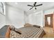 Bright main bedroom with plank floors, ceiling fan, and a closet with sliding doors for ample storage at 2546 N 9Th St, Phoenix, AZ 85006