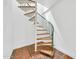 Unique spiral staircase featuring wood steps, green railings, and white risers creates an architectural statement at 2546 N 9Th St, Phoenix, AZ 85006