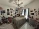 Cozy bedroom features a ceiling fan and unique decor at 2635 W Hearn Rd, Phoenix, AZ 85023