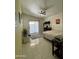 Cozy bedroom features tile floors, a ceiling fan, and sliding glass door at 2635 W Hearn Rd, Phoenix, AZ 85023