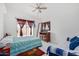 Comfortable bedroom with a ceiling fan, dresser, and a sliding glass door to the backyard at 2635 W Hearn Rd, Phoenix, AZ 85023