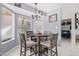 Bright dining area with a modern chandelier and a view into the inviting space beyond at 2635 W Hearn Rd, Phoenix, AZ 85023