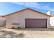 Charming single-story home showcasing a well-maintained two-car garage, xeriscaping, and a neutral color palette at 2635 W Hearn Rd, Phoenix, AZ 85023