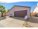 Well-kept single-story home exhibiting xeriscaping, and a neutral color palette under a clear blue sky at 2635 W Hearn Rd, Phoenix, AZ 85023
