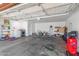 Spacious garage featuring ample storage, a laundry area, and various tools and equipment at 2635 W Hearn Rd, Phoenix, AZ 85023