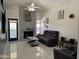 Cozy living room features a fireplace, ceiling fan, and modern furniture at 2635 W Hearn Rd, Phoenix, AZ 85023