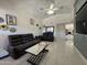 Spacious living room offers plenty of seating, modern furniture, and a ceiling fan at 2635 W Hearn Rd, Phoenix, AZ 85023