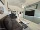 Bright living room features vaulted ceilings, modern furniture, and a ceiling fan at 2635 W Hearn Rd, Phoenix, AZ 85023