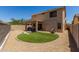 Expansive backyard featuring a covered patio and ample space for outdoor activities and relaxation at 27420 N 63Rd Dr, Phoenix, AZ 85083
