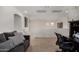Bright loft featuring a desk, comfortable couch, and neutral-colored walls, perfect for relaxation at 27420 N 63Rd Dr, Phoenix, AZ 85083