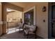 Cozy front porch area featuring comfortable seating, providing a relaxing outdoor space at 27420 N 63Rd Dr, Phoenix, AZ 85083