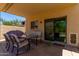 Inviting covered patio with a dining set, perfect for outdoor dining and relaxation at 27420 N 63Rd Dr, Phoenix, AZ 85083