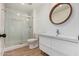 Bathroom with subway tile surround, shower, modern vanity, and a round mirror at 2834 S Extension Rd # 2005, Mesa, AZ 85210