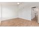 Large, bright bedroom with wood flooring, ceiling fan, and doorway to ensuite at 2834 S Extension Rd # 2005, Mesa, AZ 85210