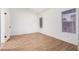 Bedroom with wood-look floors, white walls, base molding, and two windows at 2834 S Extension Rd # 2005, Mesa, AZ 85210