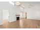 Open living room with high ceilings, wood floors, neutral paint, and a stone fireplace at 2834 S Extension Rd # 2005, Mesa, AZ 85210