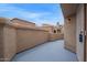 Enclosed patio with painted floor offering privacy, security gate, exterior lighting and rooftop views at 2834 S Extension Rd # 2005, Mesa, AZ 85210