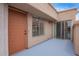 Private patio featuring a painted concrete floor, a sliding glass door, and a secure front entry at 2834 S Extension Rd # 2005, Mesa, AZ 85210
