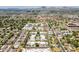 Aerial view of a residential neighborhood with mature trees, single-Gathering homes, and desert mountain landscape at 3115 N 26Th St, Phoenix, AZ 85016