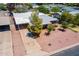 Aerial view of home with a driveway, desert landscaping, and a cozy front yard at 3115 N 26Th St, Phoenix, AZ 85016