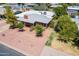 Aerial view of home with a driveway, desert landscaping, and mature trees at 3115 N 26Th St, Phoenix, AZ 85016