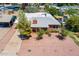 Aerial view of home with a driveway, desert landscaping, and mature trees at 3115 N 26Th St, Phoenix, AZ 85016
