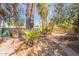 Spacious backyard featuring trees, block fencing, and a walkway at 3115 N 26Th St, Phoenix, AZ 85016