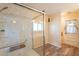 Accessible bathroom featuring marble shower and modern glass door for easy access at 3115 N 26Th St, Phoenix, AZ 85016