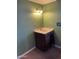 Bathroom sink with a vintage faucet and cabinet, blending functionality with a classic design aesthetic at 3115 N 26Th St, Phoenix, AZ 85016