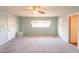 Spacious bedroom with plush carpeting, ceiling fan, and two closets offer ample storage at 3115 N 26Th St, Phoenix, AZ 85016