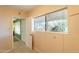 Bedroom featuring large window, tiled flooring, and door leading to another room at 3115 N 26Th St, Phoenix, AZ 85016